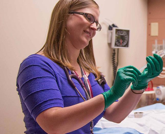 Why work at Covenant Health A staff member with a stethoscope smiles as she works