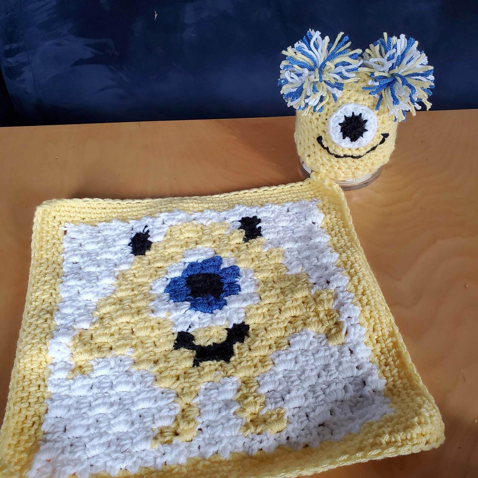 A crochet doll and small crochet towel