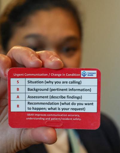 A SBAR card being held up