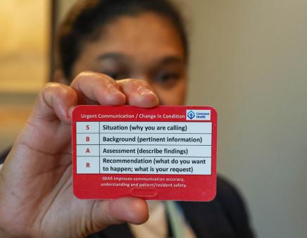 A SBAR card being held up